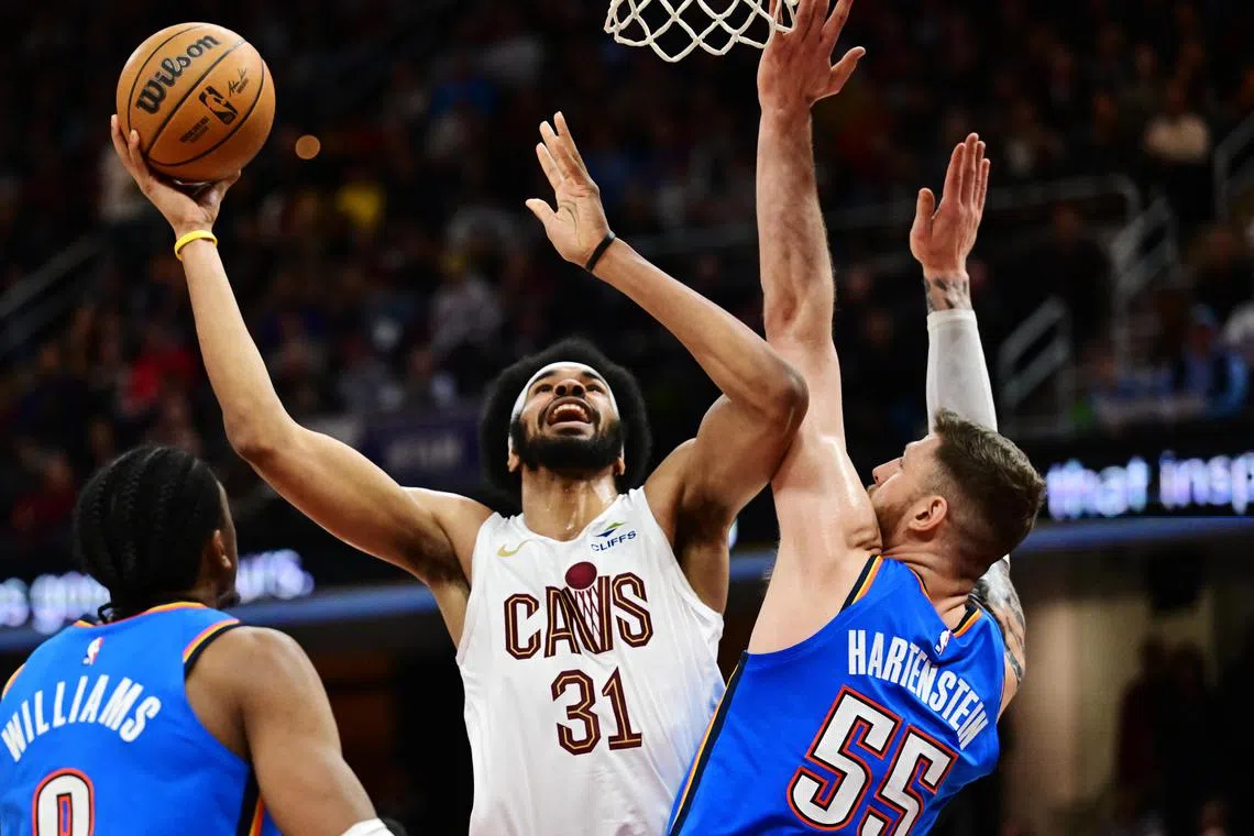 Cleveland Cavaliers centre Jarrett Allen drives to the basket against Oklahoma City Thunder centre Isaiah Hartenstein during the second half at Rocket Mortgage FieldHouse.