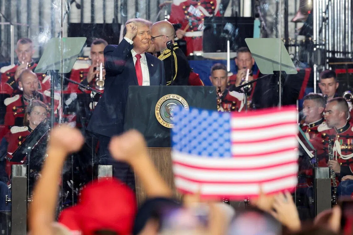 US President Donald Trump dancing at a rally to kick off the Great American State Fair in celebration of 250 years of US independence at the National Mall in Washington on June 24.