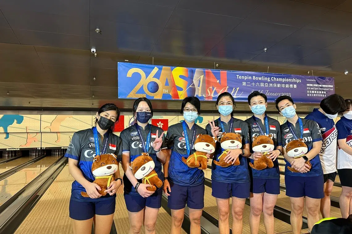 Singapore's bowlers posing with their silver medals in the women's team-of-five event at the 26th Asian Tenpin Bowling Championships in Hong Kong.