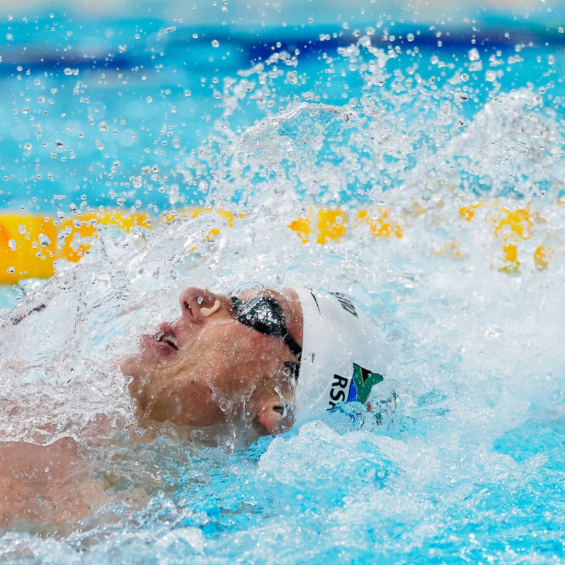 FILE PHOTO: Commonwealth Games 2026 - Swimming - Tollcross International Swimming Centre, Glasgow, Scotland, Britain - July 29, 2026  South Africa's Pieter Coetze in action during the men's 100m backstroke final REUTERS/Andrew Couldridge/File Photo