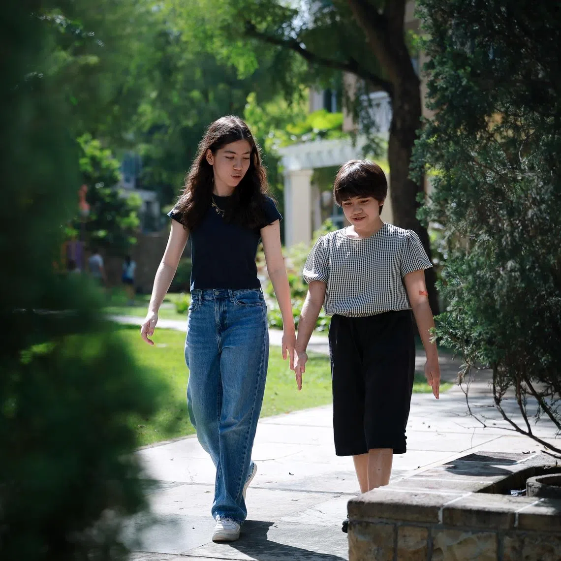 Sawako Evelyne Maury (left) is a caregiver to her elder sister Ayano Justine Maury (right), who has autism spectrum disorder and global developmental delay.