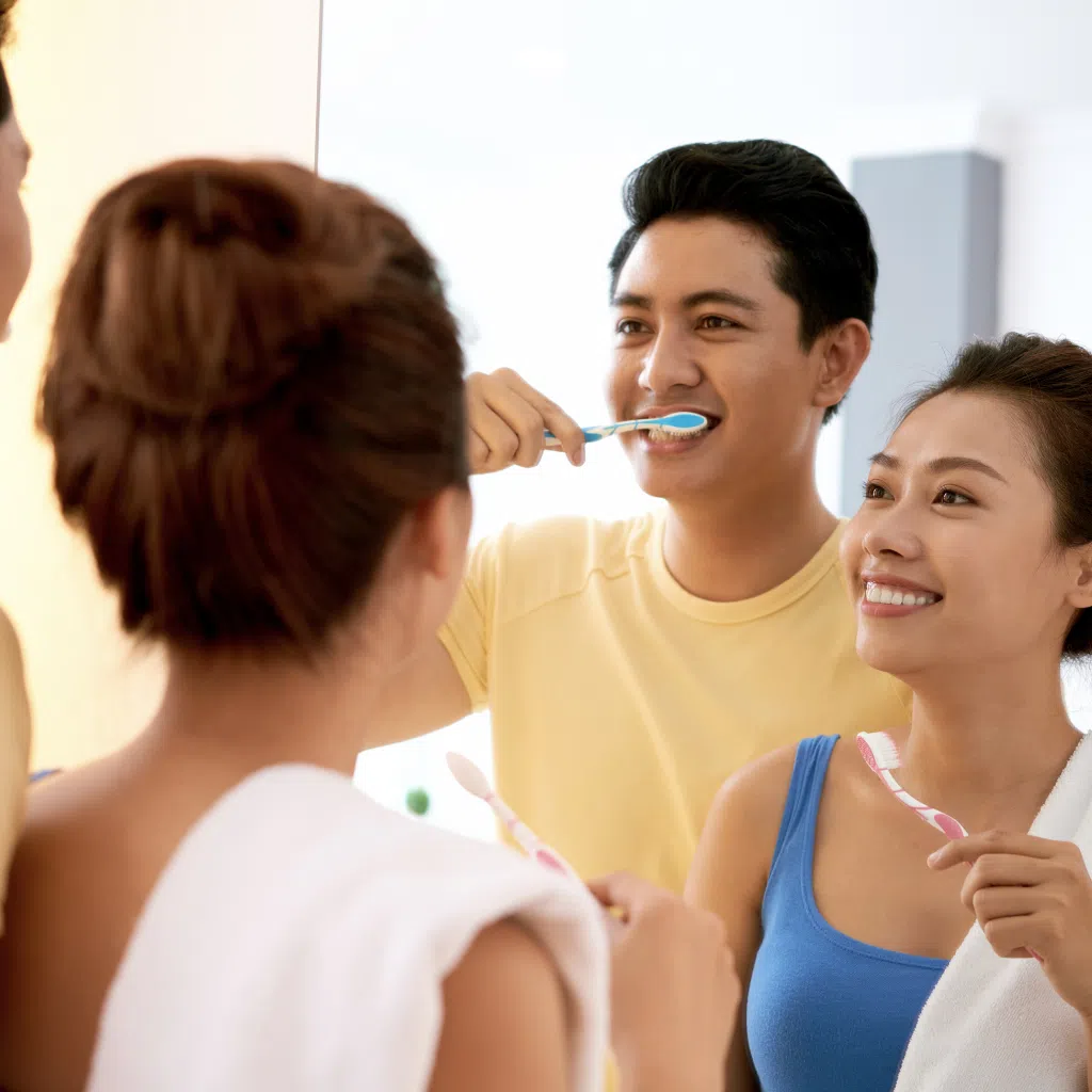Couple brushing teeth