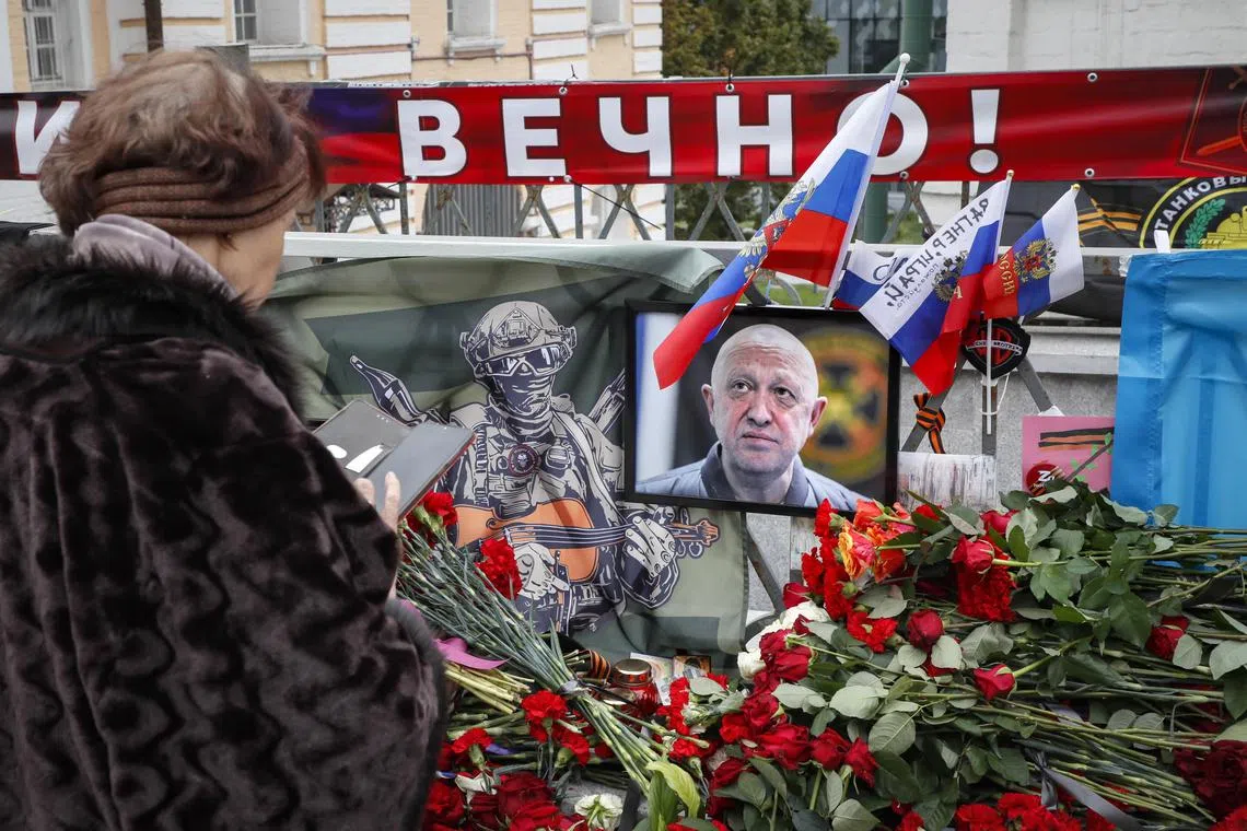 A portrait of mercenary leader Yevgeny Prigozhin is seen at a makeshift memorial in Saint Petersburg, Russia.