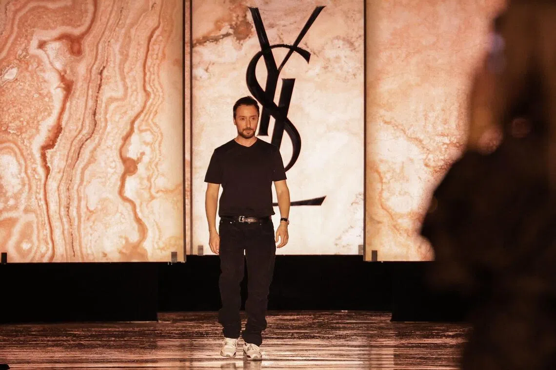 (FILES) Belgian-Italian fashion designer Anthony Vaccarello reacts after the presentation of creations by Saint Laurent for the Womenswear Ready-to-wear Fall-Winter 2025/2026 collection as part of the Paris Fashion Week, in Paris on March 11, 2025. French fashion house Saint-Laurent announces on October 9, 2026 the departure of its creative director Anthony Vaccarello. (Photo by Thibaud MORITZ / AFP)