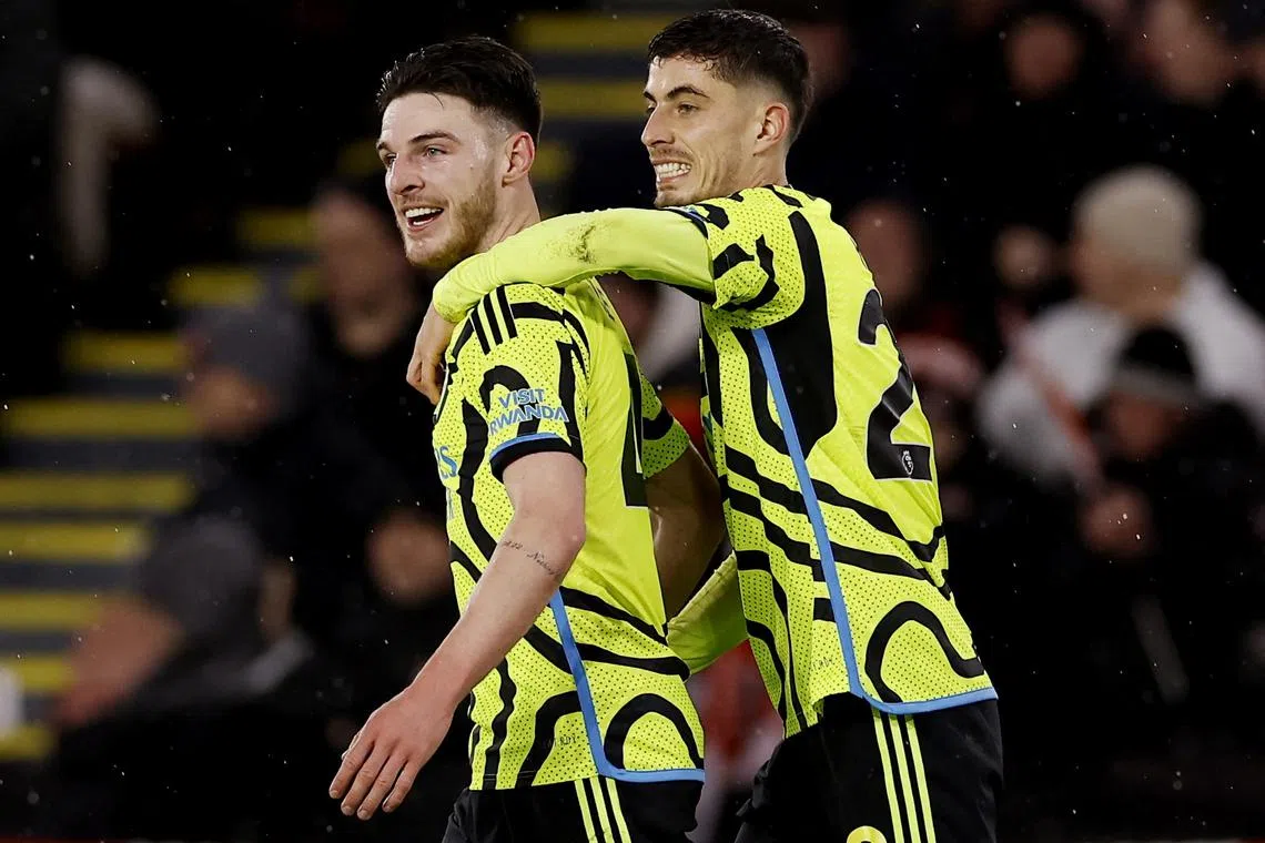 Soccer Football - Premier League - Sheffield United v Arsenal - Bramall Lane, Sheffield, Britain - March 4, 2024 Arsenal's Declan Rice celebrates scoring their fifth goal with Kai Havertz Action Images via Reuters/Jason Cairnduff