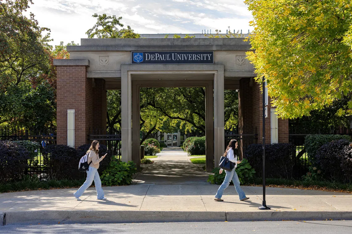 Students walk outside the campus of DePaul University in Chicago, Illinois, U.S., October 2, 2025. REUTERS/Jim Vondruska