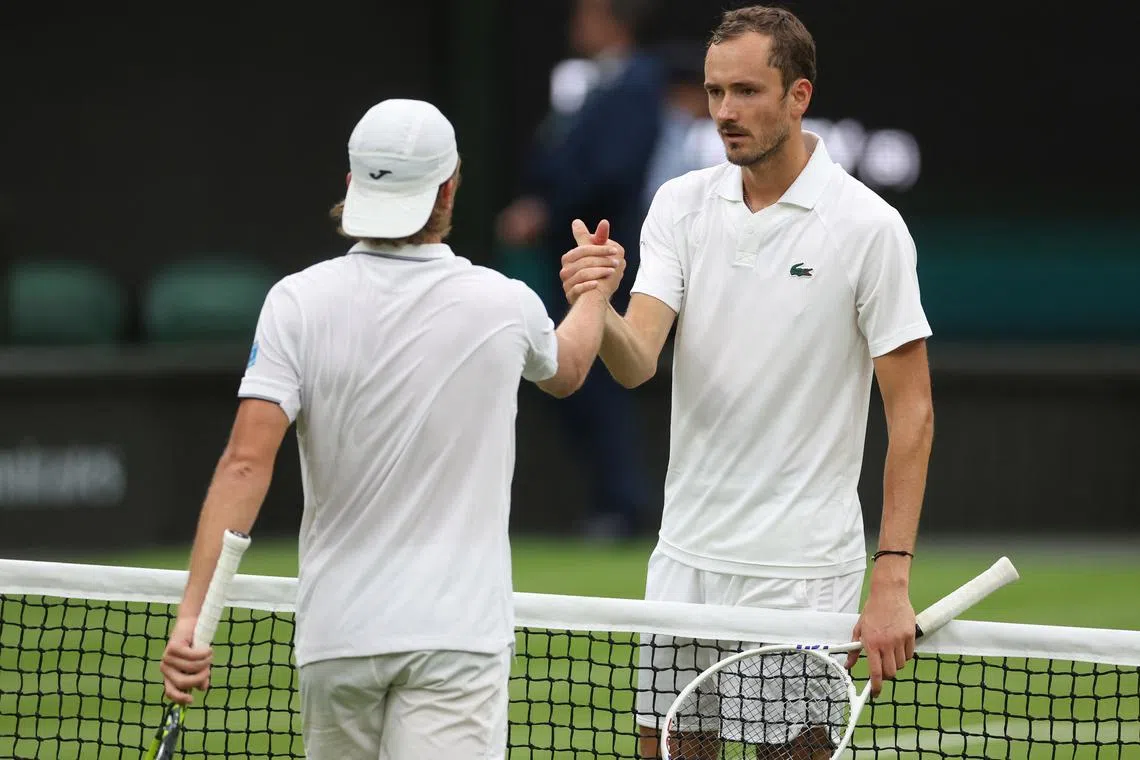 Tennis - Wimbledon - All England Lawn Tennis and Croquet Club, London, Britain - July 3, 2024 Russia's Daniil Medvedev celebrates winning his second round match against France's Alexandre Muller REUTERS/Paul Childs