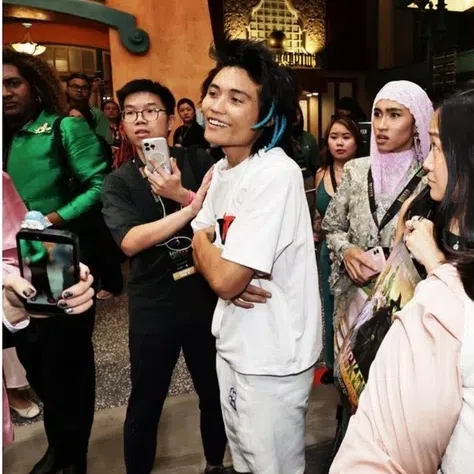Johnson Wen (left) caused a commotion during the premiere of Wicked: For Good on Nov 13 by charging towards Ariana Grande, who stars in the movie.