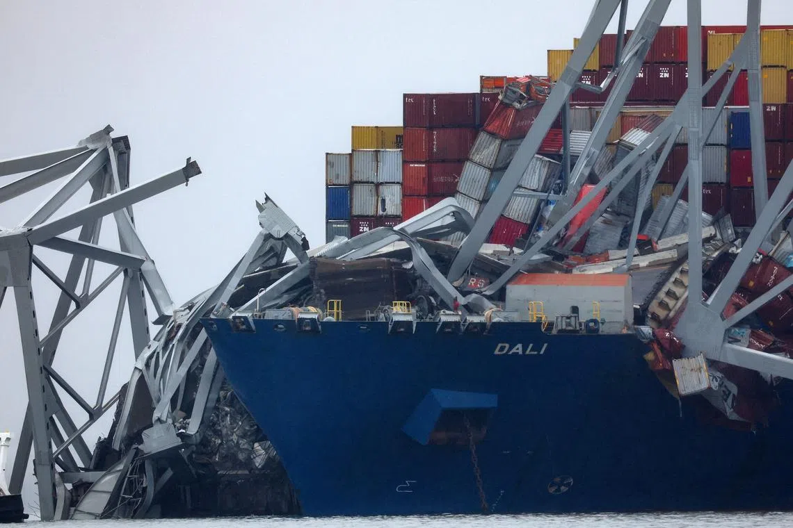 Wreckage lies across the deck of the Dali cargo vessel, which crashed into the Francis Scott Key Bridge causing it to collapse, in Baltimore, Maryland, U.S., March 27, 2024. REUTERS/Mike Segar/File Photo