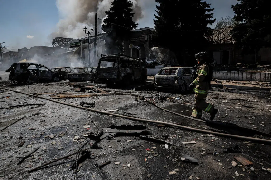 A firefighter working at the site of a Russian drone strike in the town of Druzhkivka, in Ukraine's eastern Donetsk region, on Aug 2.