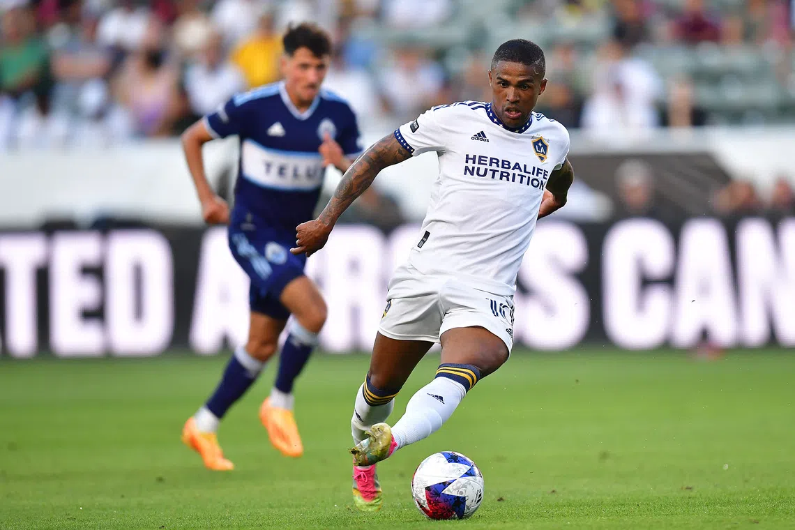 Jul 30, 2023; Carson, CA, USA; Los Angeles Galaxy forward Douglas Costa (10) moves the ball against Vancouver Whitecaps during the second half at Dignity Health Sports Park. Mandatory Credit: Gary A. Vasquez-USA TODAY Sports