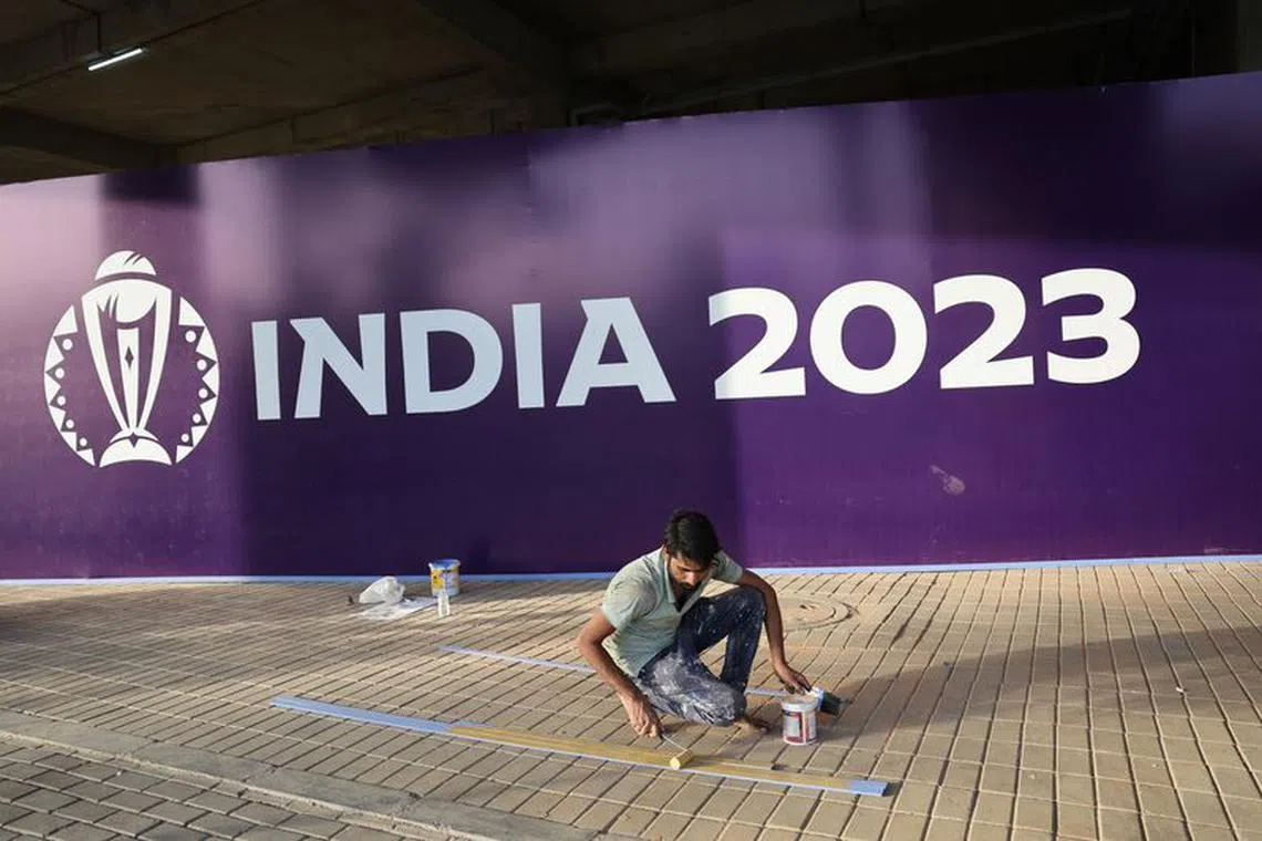 FILE PHOTO: Cricket - World Cup - Previews - Narendra Modi Stadium, Ahmedabad, India - October 3, 2023 Workers prepare the stadium ahead of the first game in the world cup REUTERS/Amit Dave/File Photo