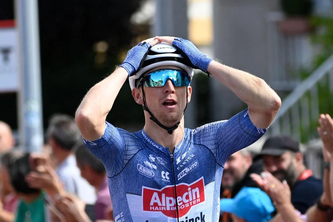 Team Alpecin's Kaden Groves celebrates crossing the finish line first in stage 14 of the Vuelta a Espana, a 200.5 km ride from Villafranca del Bierzo to Villablino, on Aug 31, 2024.