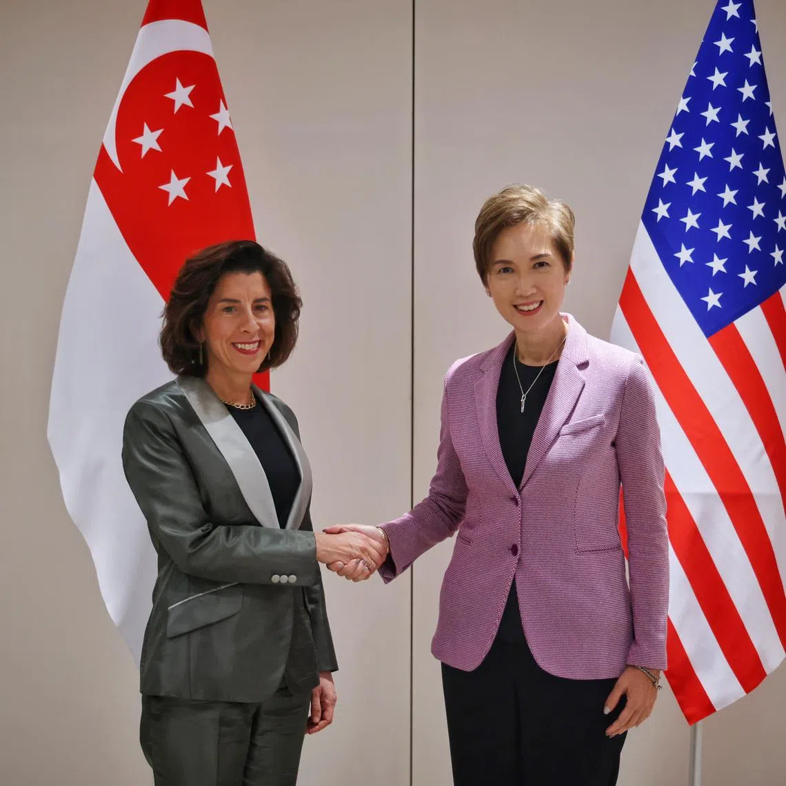 Communications and Information Minister Josephine Teo (right) meeting US Secretary of Commerce Gina Raimondo  before a roundtable on AI on June 5.
