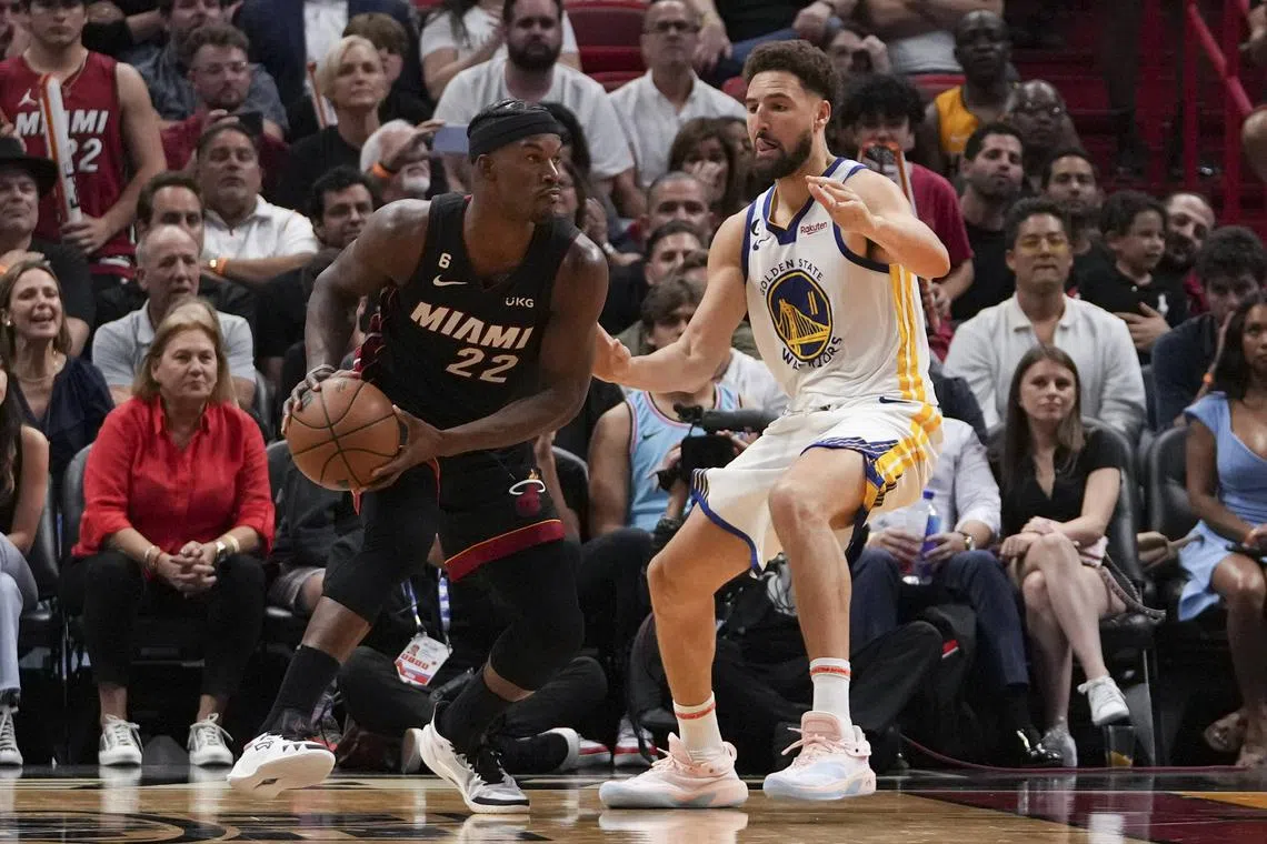 Jimmy Butler of the Miami Heat is defended by Klay Thompson of the Golden State Warriors during the second half at FTX Arena on Nov 1, 2022.