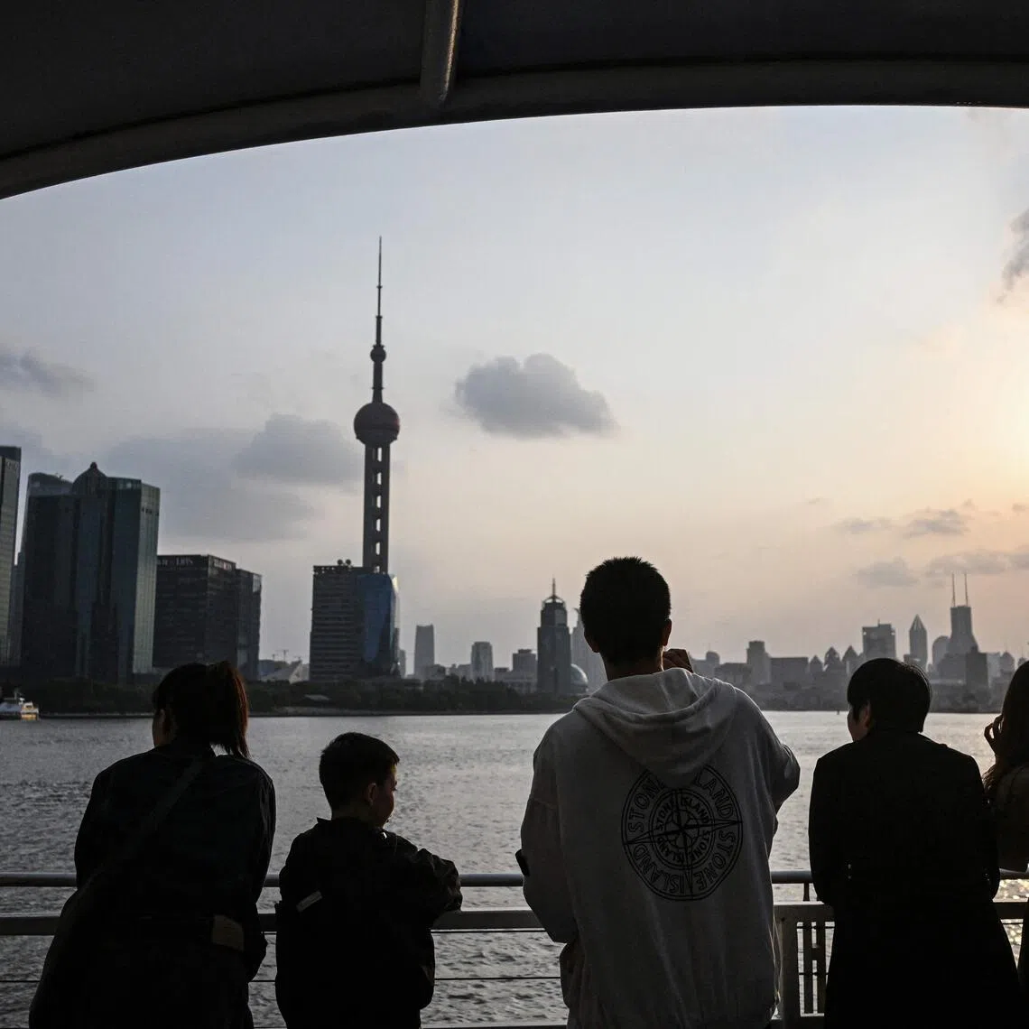 The Lujiazui financial district, as seen from a ferry on the Huangpu river in Shanghai, China. 