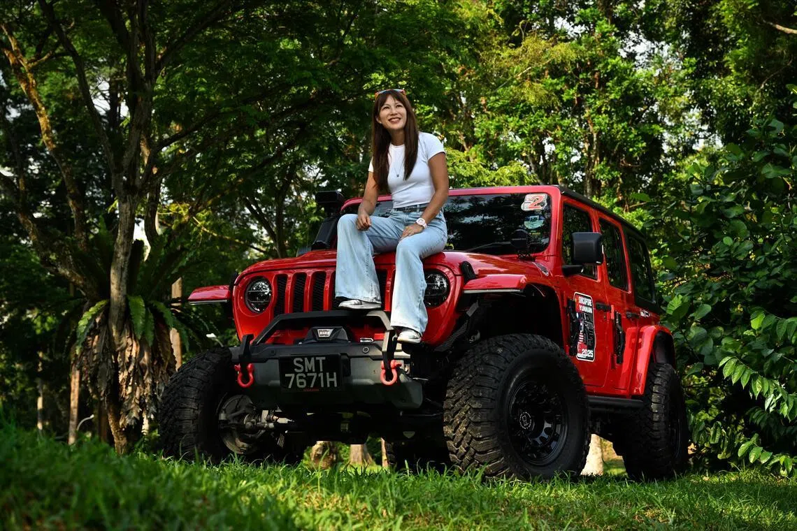 Leong Khay Mun and her red Jeep Wrangler Sahara Unlimited, affectionately dubbed Red Baron.