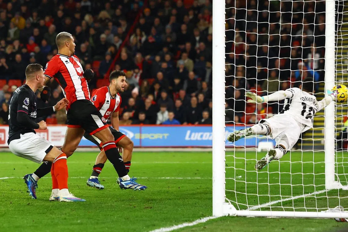 Sheffield United's Jack Robinson scores an own goal - and Luton Town's second - past Sheffield's Wes Foderingham.