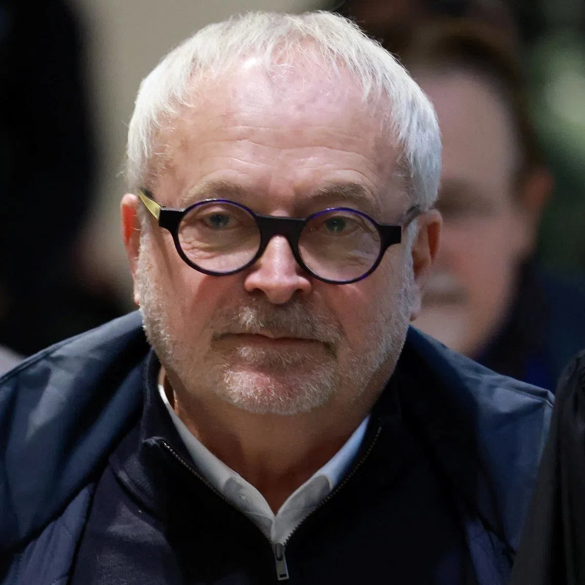 Former French Senator Joel Guerriau arrives with his lawyer Henri Carpentier for a hearing in his trial for allegedly spiking member of parliament Sandrine Josso's drink with the intention of sexually assaulting her, at the courthouse in Paris, France, January 26, 2026. REUTERS/Stephanie Lecocq