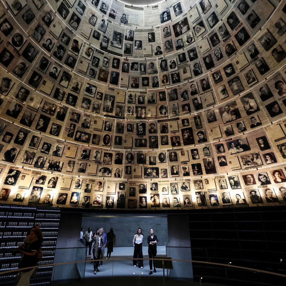 FILE PHOTO: Visitors tour an exhibition, ahead of Israel's national Holocaust memorial day at Yad Vashem, the World Holocaust Remembrance Center, in Jerusalem April 23, 2025. REUTERS/Ronen Zvulun/File Photo