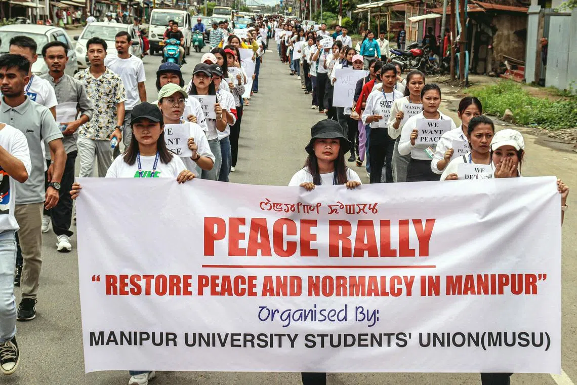 Members of the Manipur University Students' Union (MUSU) protest over sexual violence against women and for peace in the ongoing ethnic violence in India's north-eastern state of Manipur, in Imphal on July 24, 2023. At least 120 people have been killed during months of ethnic conflict between the predominantly Hindu Meitei majority and the mainly Christian Kuki in India's troubled northeastern state of Manipur. (Photo by AFP)