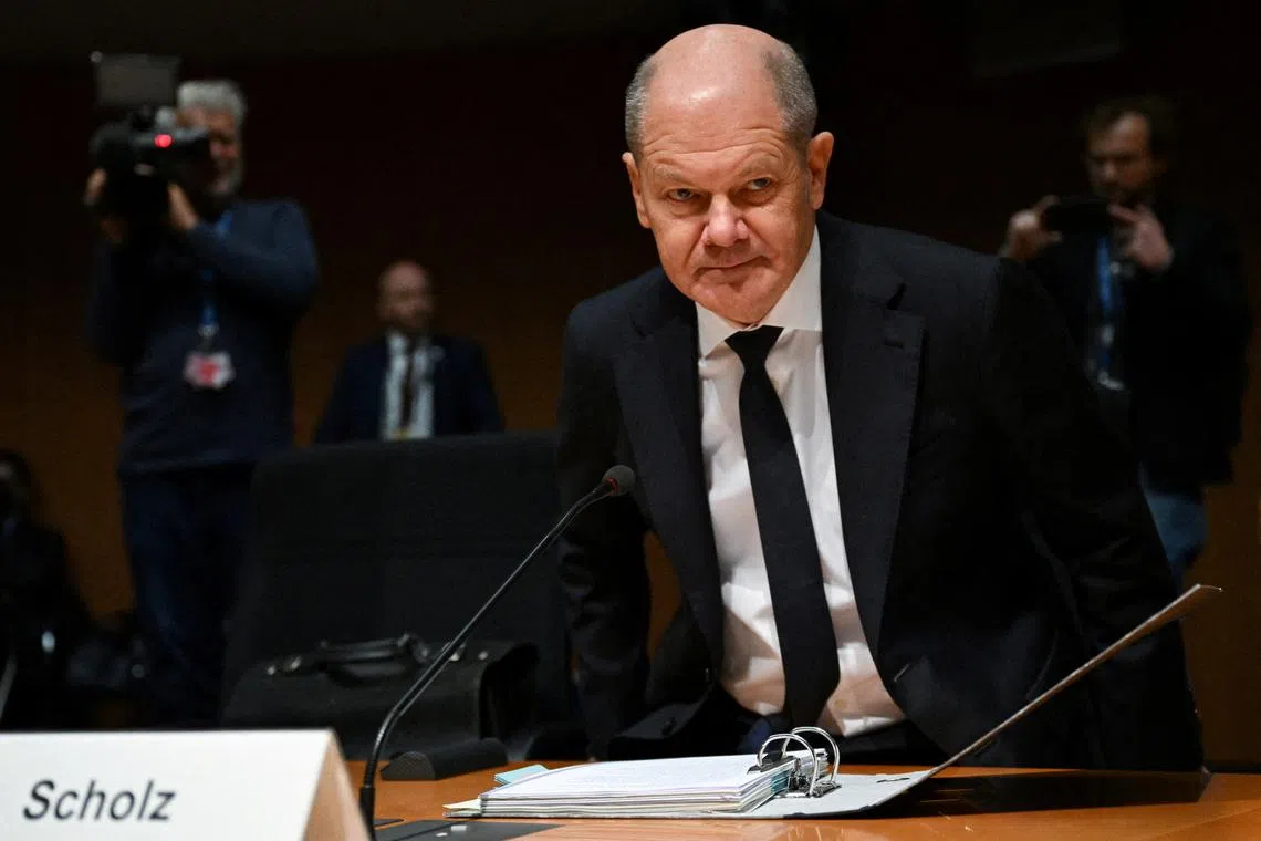 FILE PHOTO: German Chancellor Olaf Scholz attends a public hearing of the 'Nuclear phase-out' committee of enquiry in Berlin, Germany January 16, 2025.  REUTERS/Annegret Hilse/File Photo