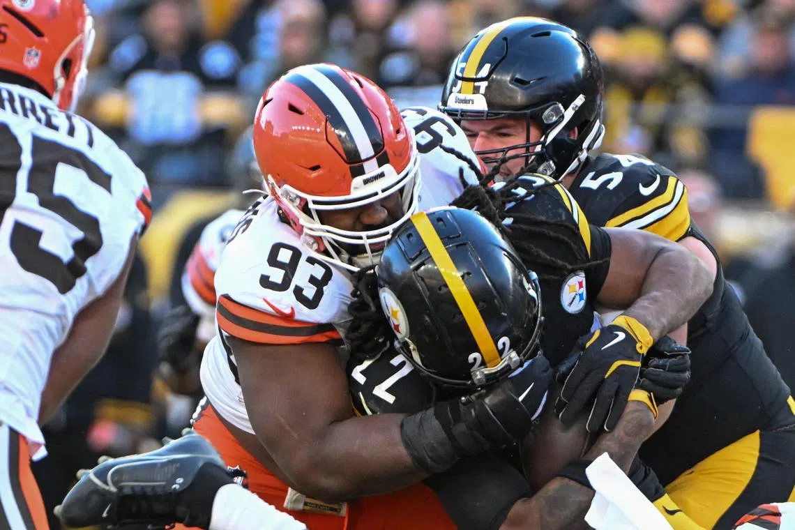 FILE PHOTO: Dec 8, 2024; Pittsburgh, Pennsylvania, USA; Cleveland Browns defensive tackle Shelby Harris (93) tackles Pittsburgh Steelers running back Najee Harris (22) during the third quarter at Acrisure Stadium. Mandatory Credit: Barry Reeger-Imagn Images/File photo