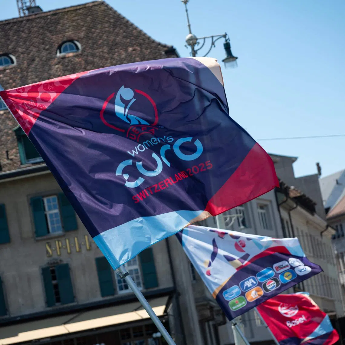 Flags of the 2025 Women's European Championship fly on a bridge in Basel on July 2, 2025.