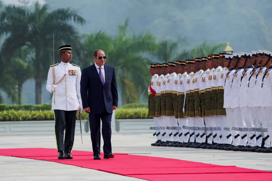 Egyptian President Abdel Fattah al-Sisi inspects a guard of honour during a state welcoming ceremony at the National Palace in Kuala Lumpur, Malaysia, October 10, 2026. REUTERS/Hasnoor Hussain/Pool