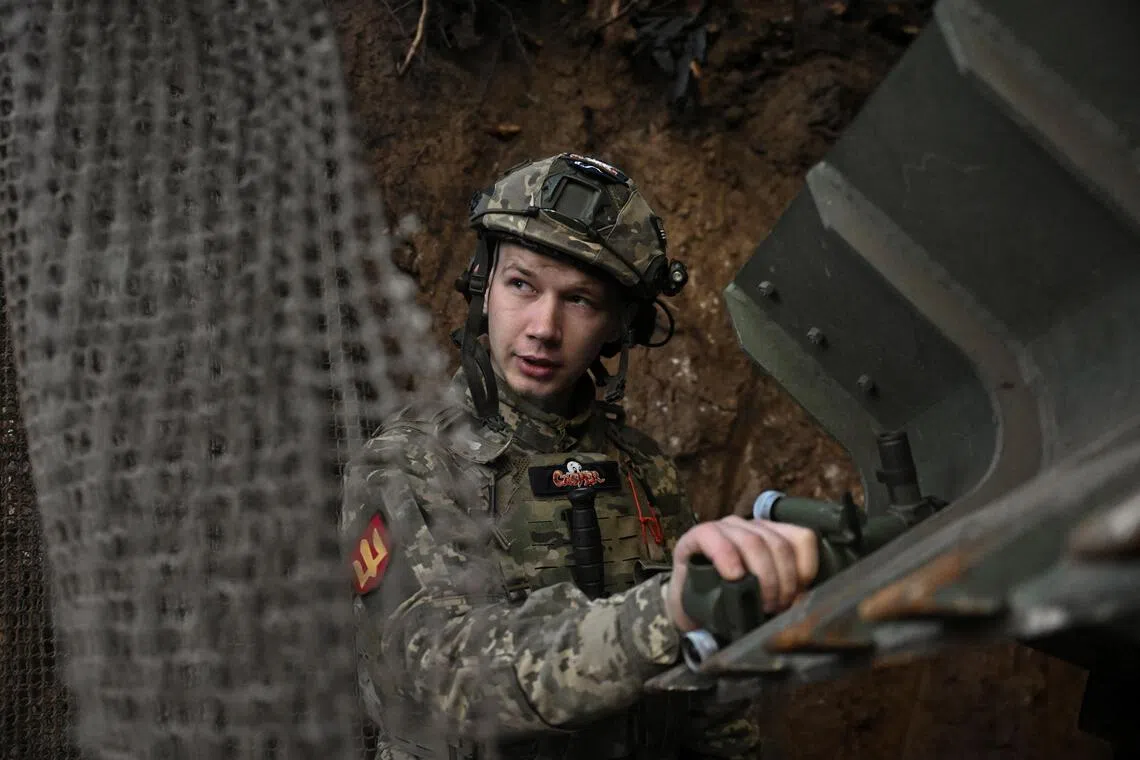 A Ukrainian serviceman preparing a self-propelled howitzer for firing towards Russian troops, at a front-line position in  Ukraine's Zaporizhzhia region, on Sept 13.