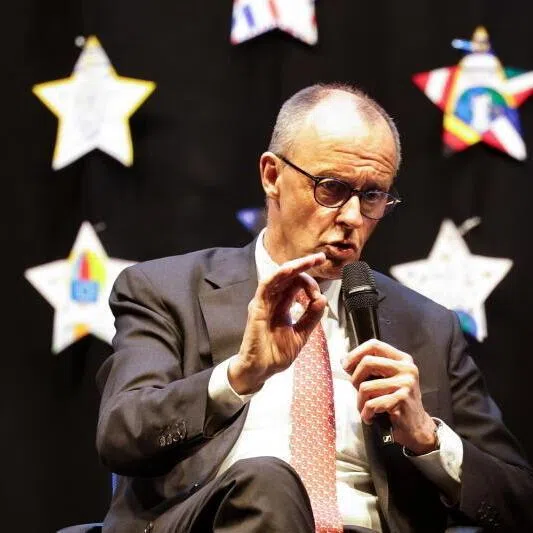 German Chancellor Friedrich Merz talking to students during his visit at Carolus-Magnus-Gymnasium in Marsberg, Germany, on April 27.