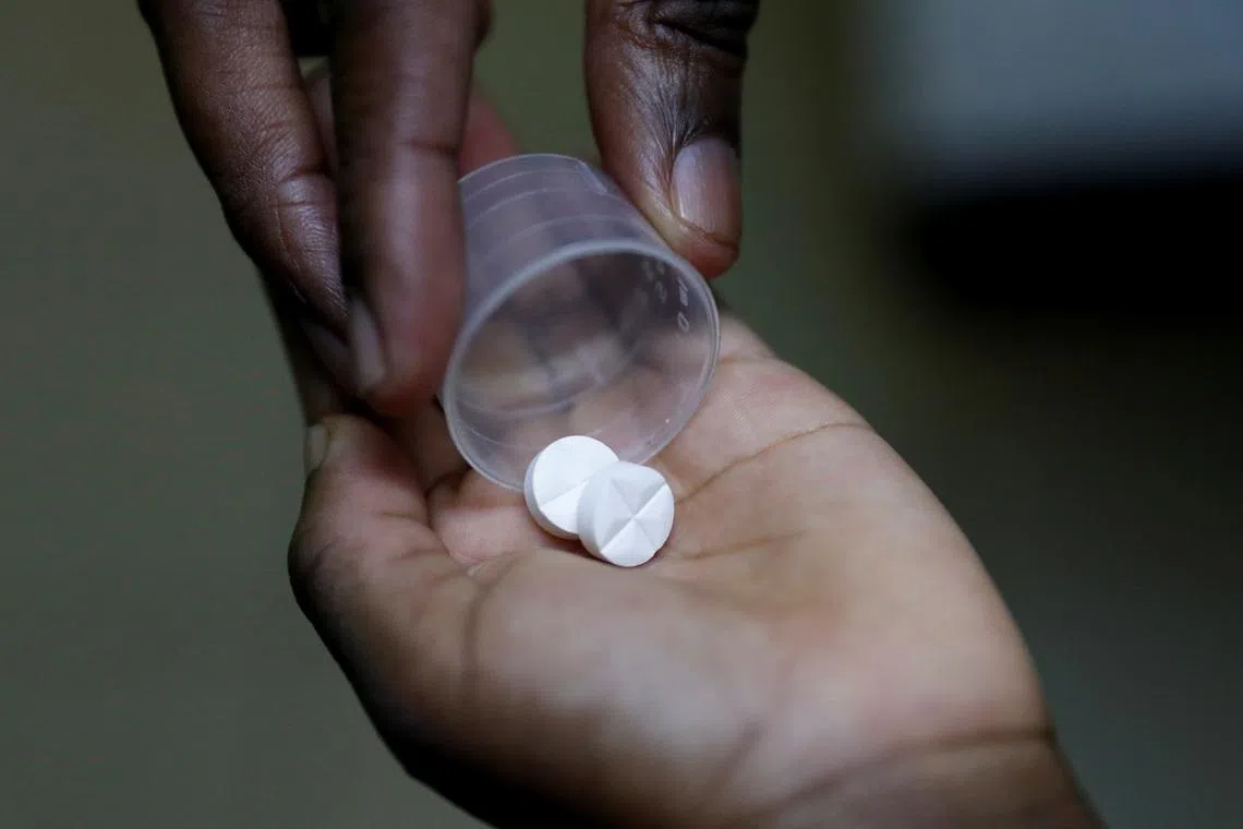 FILE PHOTO: A nurse dispenses an antiretroviral (ARV) drug used to prevent HIV from replicating, to a child at a children's home in Karen district of Nairobi, Kenya, February 12, 2025. REUTERS/Thomas Mukoya/File Photo
