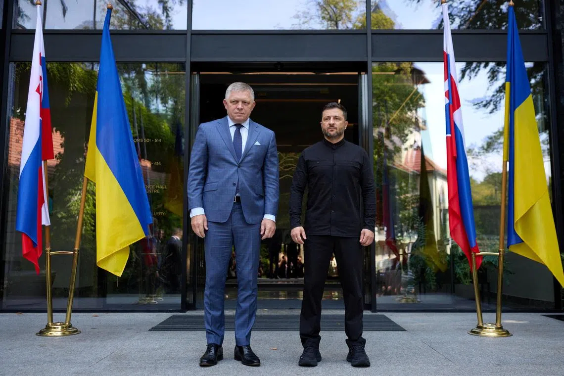 Ukrainian President Volodymyr Zelensky (right) welcoming Slovakian Prime Minister Robert Fico to Ukraine on Sept 5.