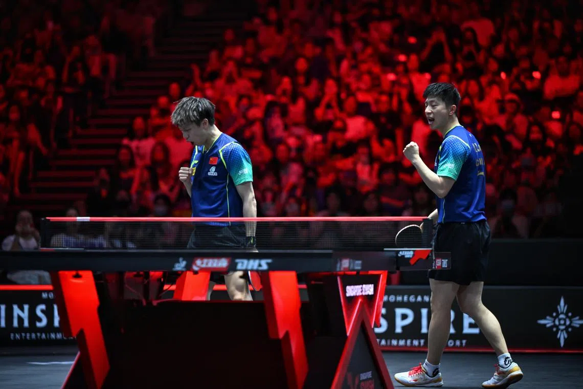 China's Ma Long and Lin Gaoyuan win the Singapore Smash men's doubles final in front of a packed crowd at the OCBC Arena Hall 1 on March 16.