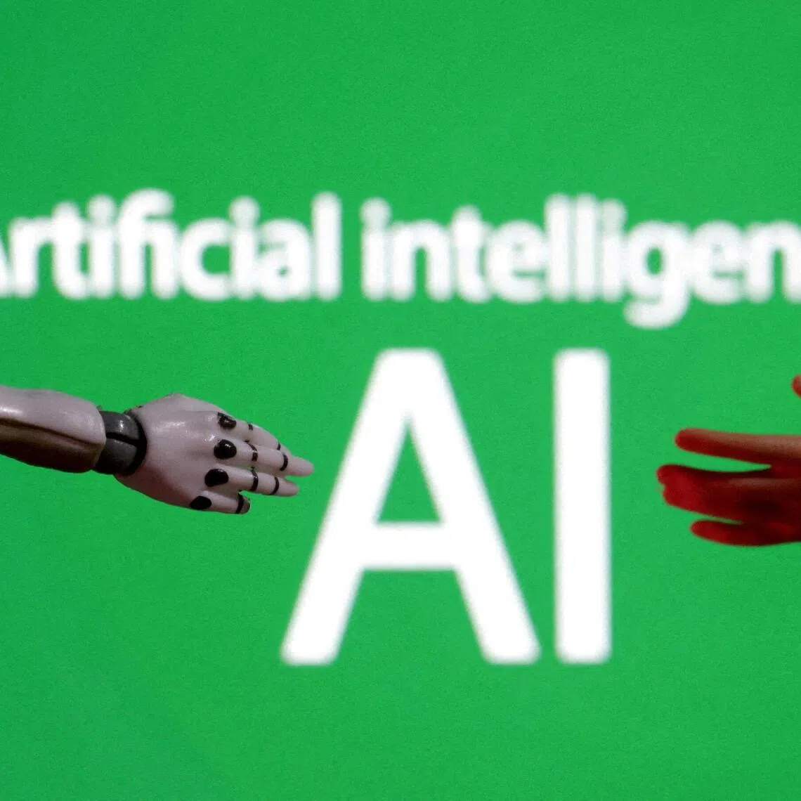 FILE PHOTO: Words reading "Artificial intelligence AI", miniature of robot and toy hand are pictured in this illustration taken December 14, 2023. REUTERS/Dado Ruvic/Illustration/File Photo