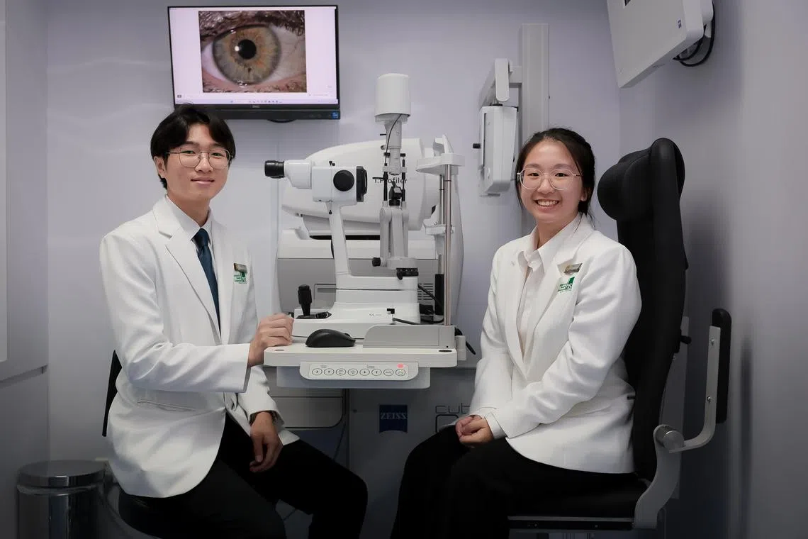 Ngee Ann Polytechnic Diploma in Optometry students Tan Kuang Hao (left) and Janelle Tan at the Ngee Ann Polytechnic Optometry Centre?s NP-ZEISS Vision Management Suite on Sep 18, 2024.