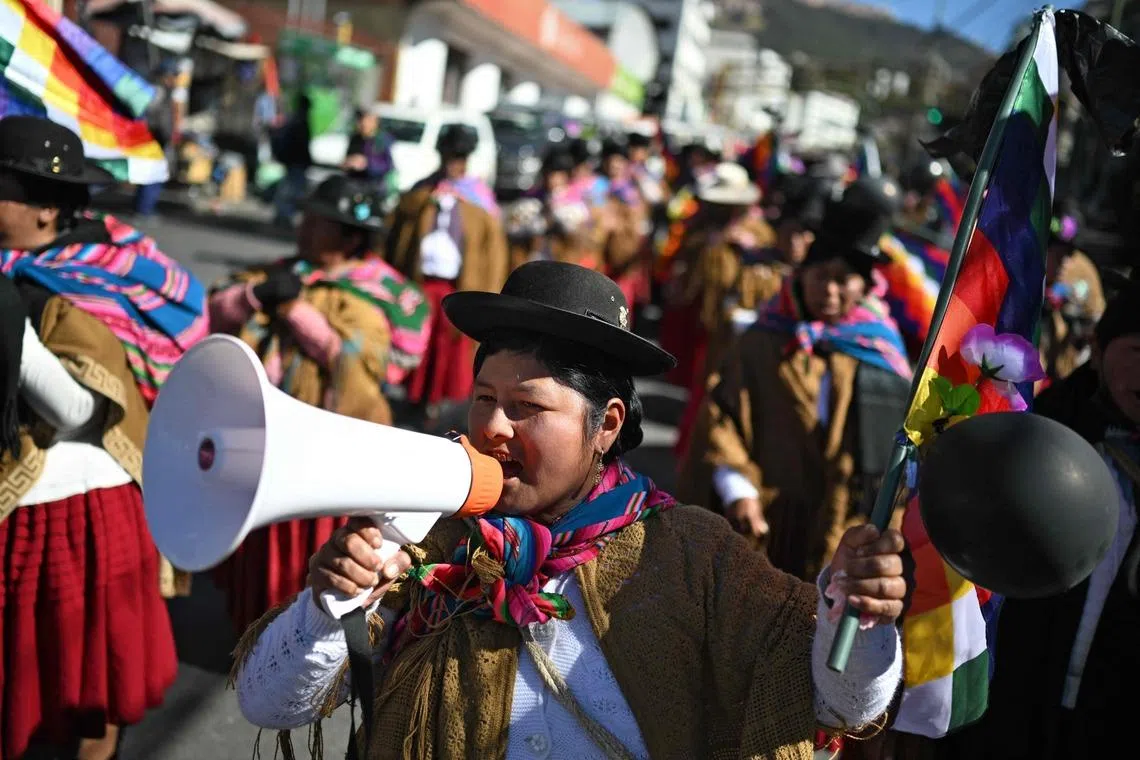 An Indigenous woman using a megaphone during a protest against the government of President Rodrigo Paz on Mother's Day in La Paz, Bolivia, on May 27, 2026. 