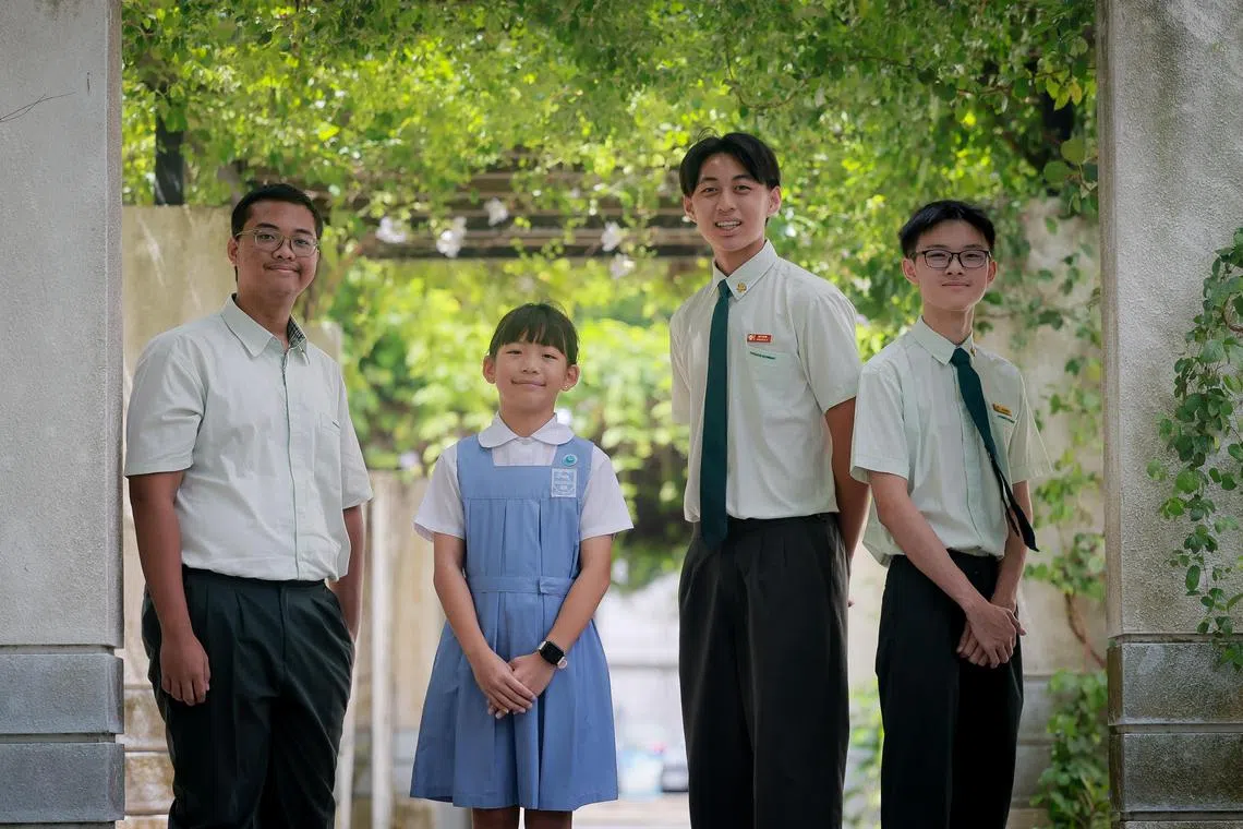 Tao Nan School pupil Chia Sze En (in blue), 10, and Evergreen Secondary School students (from left) Muhammad Aidil Putra Bin Md Indra, Jeremy Dwight Kristian and Choo Koi Heng at the Singapore Silent Heroes Student Award Ceremony held at  Spring Singapore onJuly 5, 2025.