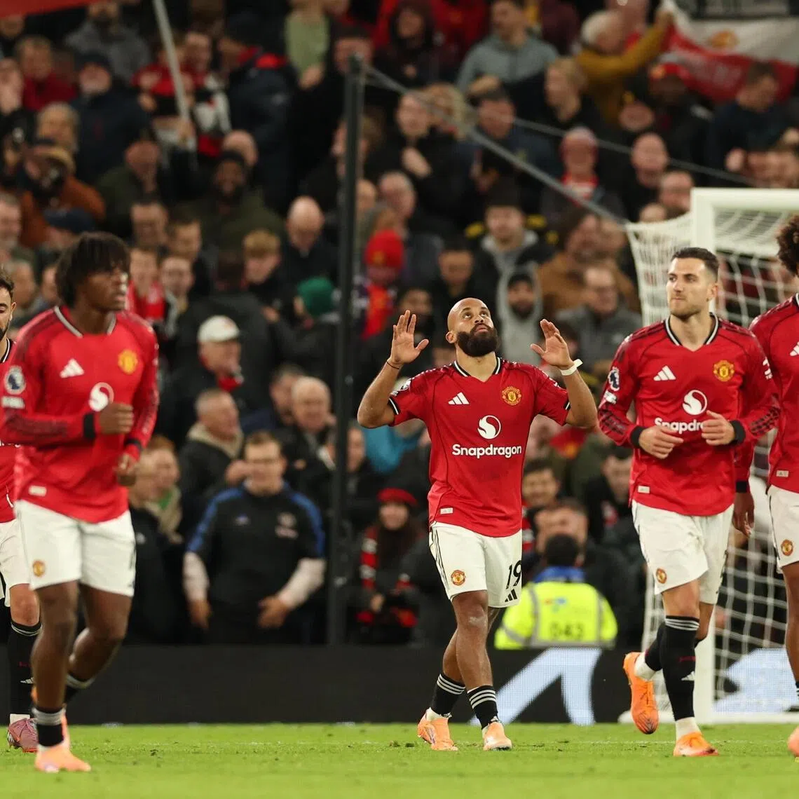 Manchester United's Bryan Mbeumo (centre) celebrates scoring his team's fourth goal against Brighton.
