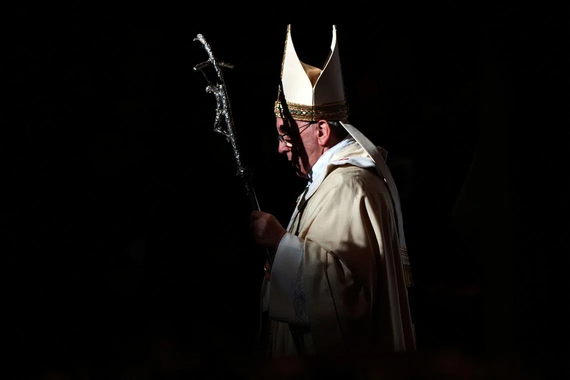 FILE PHOTO: Pope Francis walks with his pastoral staff as he leads the Epiphany mass in Saint Peter's Basilica at the Vatican January 6, 2014.  REUTERS/Max Rossi/File Photo