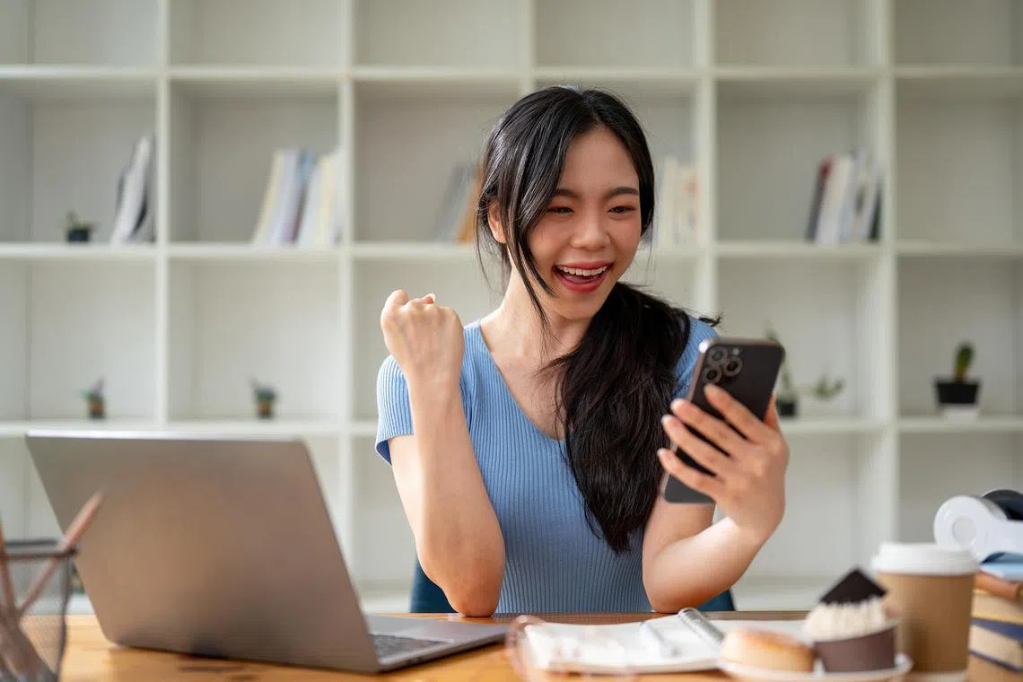 sduni05 - A cheerful and excited Asian girl is looking at her smartphone screen with a happy face, showing her fist, celebrating good news.

Credit: ISTOCKPHOTO