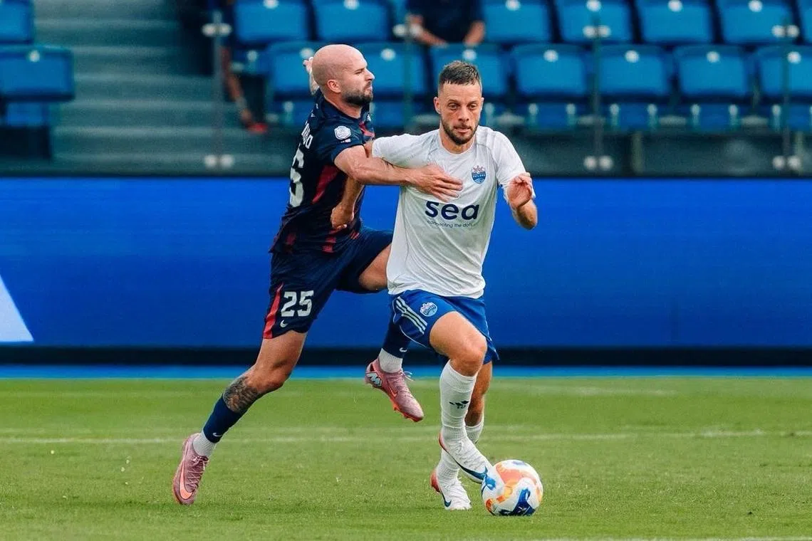 The Lion City Sailors' Bart Ramselaar, who recently penned a two-year contract extension, trying to shrug off Johor Darul Takzim's Joao Figueiredo during their 3-1 Shopee Cup defeat in August 2025.