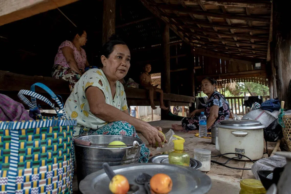 People displaced by the fighting preparing food at a shelter on the grounds of a monastery near Pakokku in Myanmar’s Magway region.