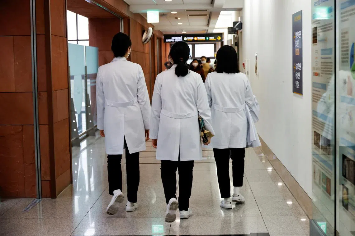 Medical workers walk at Severance Hospital in Seoul, South Korea, February 21, 2024. REUTERS/Kim Soo-hyeon/File Photo