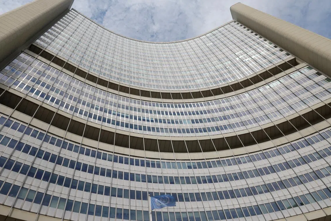 FILE PHOTO: The flag of the International Atomic Energy Agency (IAEA) flutters in front of the agency's headquarters in Vienna, Austria, June 3, 2024. REUTERS/Leonhard Foeger/File Photo