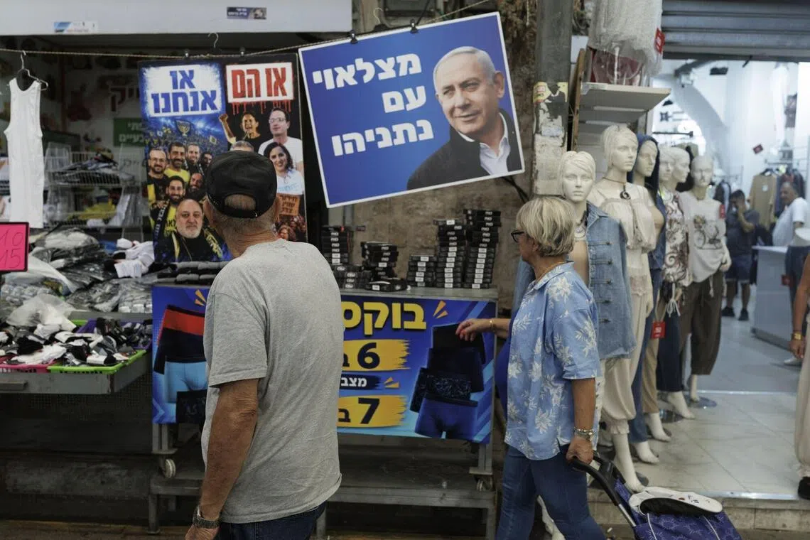 An election campaign poster for Israeli Prime Minister Benjamin Netanyahu in Tel Aviv, Israel, on Oct 14.