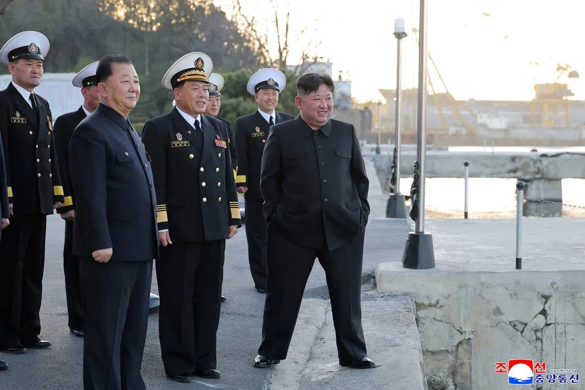 North Korean leader Kim Jong Un observes a test fire of missiles from the destroyer Choe Hyon, North Korea, on April 12.