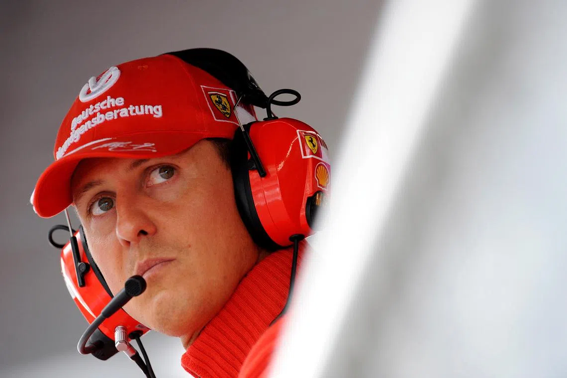 Former Ferrari driver Michael Schumacher of Germany looks on during the qualifying session for the Italian F1 Grand Prix race at the Monza racetrack in Monza, near Milan, in this September 13, 2008 file photo.   REUTERS/Alessandro Bianchi/File Photo