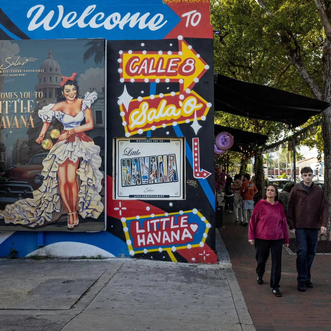 People walk past mural along Calle Ocho in the Little Havana neighborhood in Miami, Florida, U.S., February 3, 2026.
