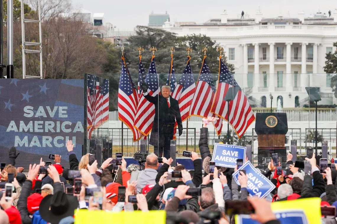 FILE PHOTO: U.S. President Donald Trump waves to supporters during a rally to contest the certification of the 2020 U.S. presidential election results by the U.S. Congress, in Washington, U.S, January 6, 2021. REUTERS/Jim Bourg/File Photo